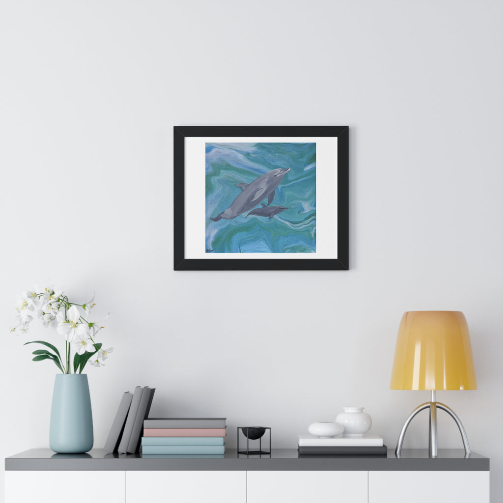 Framed artwork of dolphins on a wall above a shelf with decor items.
