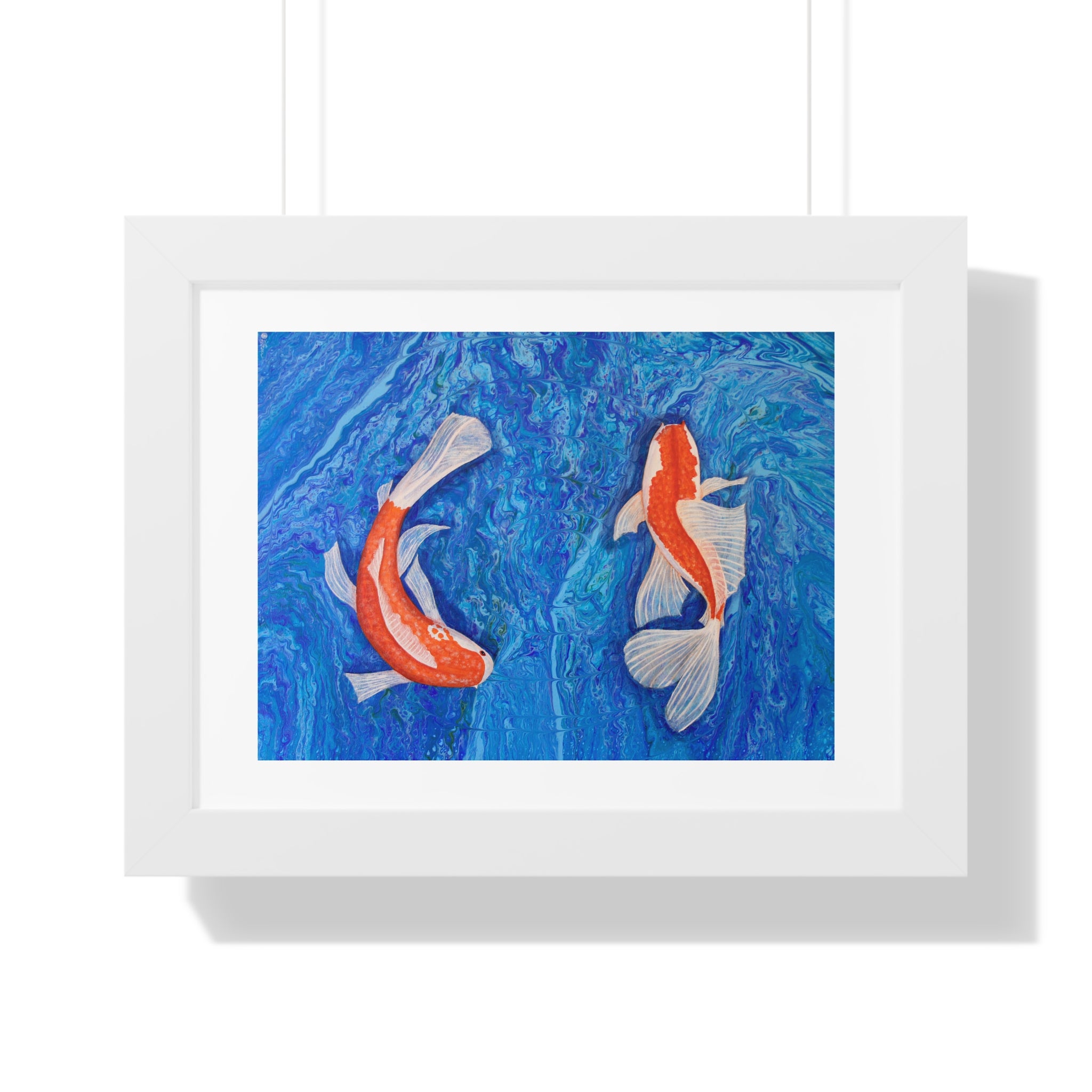 Framed artwork of two koi fish on a blue background