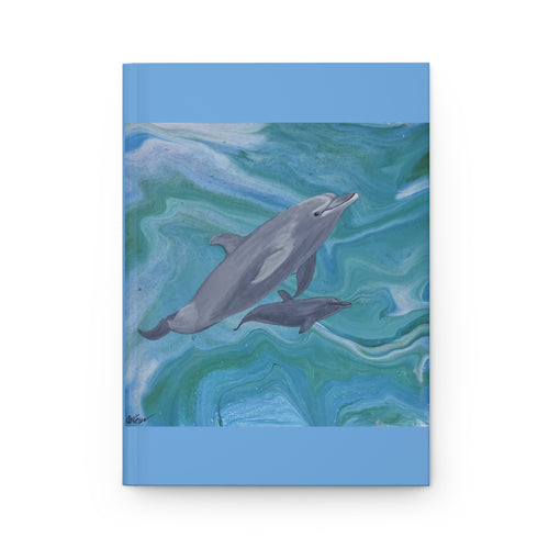 Notebook cover with dolphins on a blue and green marbled background