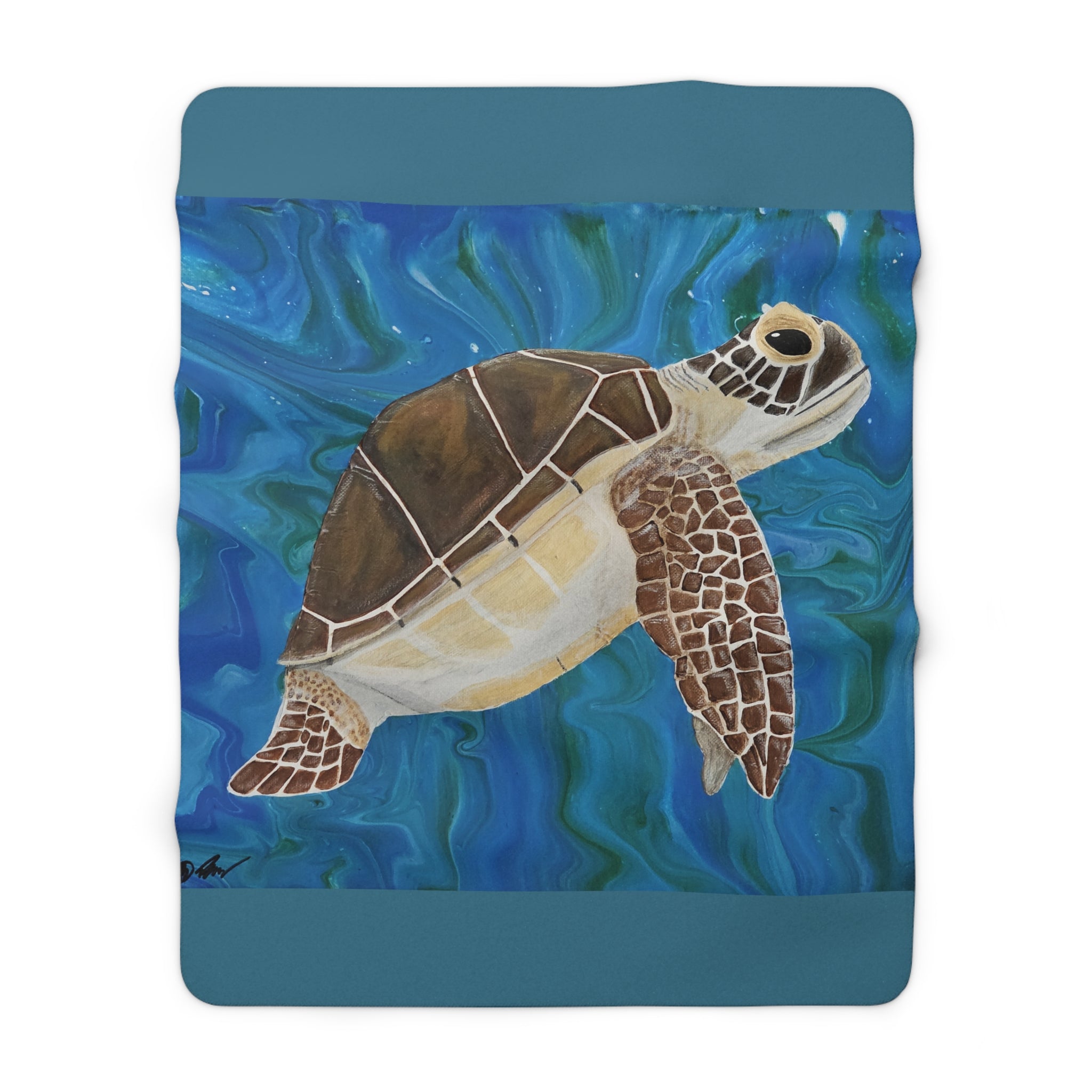 Fleece blanket with a turtle design on a blue water background