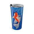 Tumbler with a koi fish design on a blue background