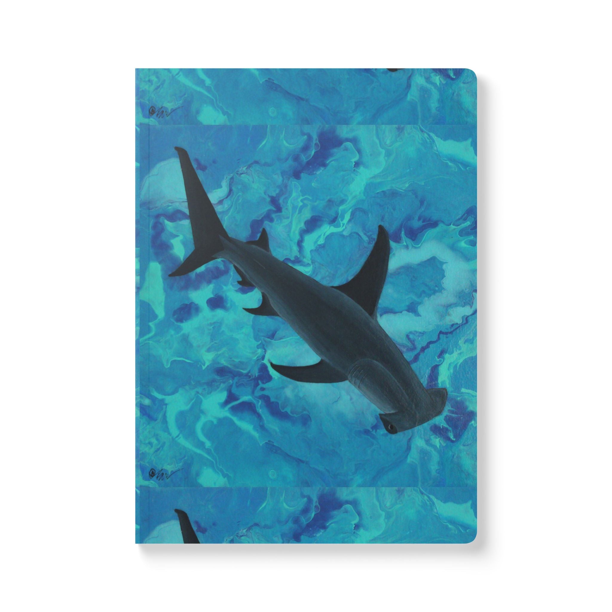 Notebook with a shark design on a blue abstract patterned cover