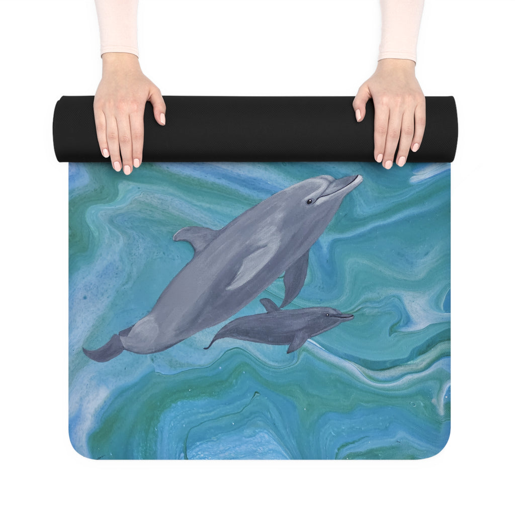 Yoga mat with dolphin design held by a person