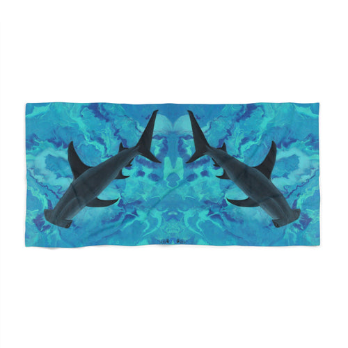 Towel/blanket with hammerhead shark design on a blue watercolor background