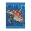 Blanket with a turtle design on a blue watercolor background