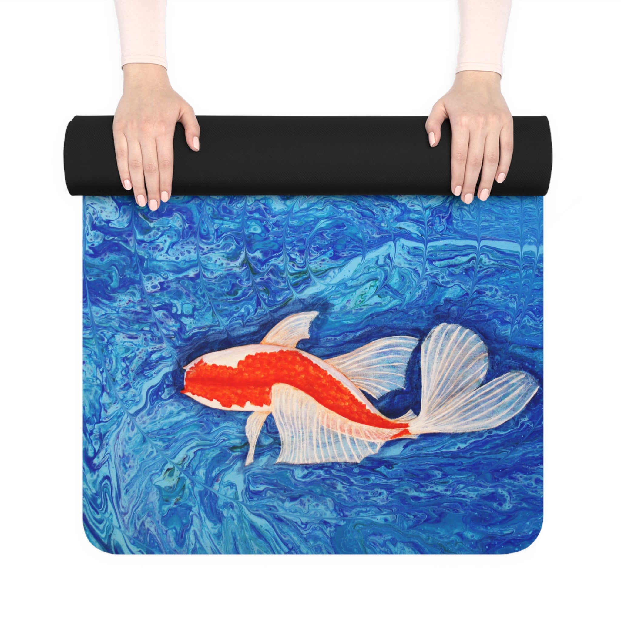 Yoga mat with a koi fish design on a blue water background