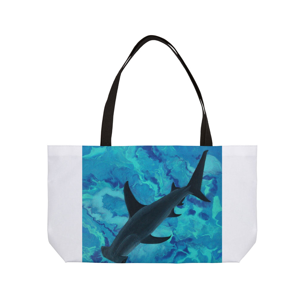 Tote bag with a shark design on a blue and white background