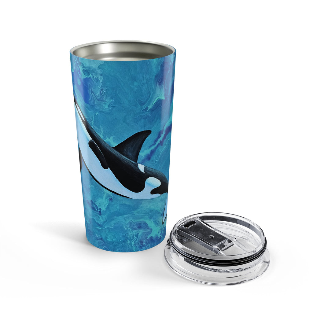 Tumbler with orca whale design on a blue background