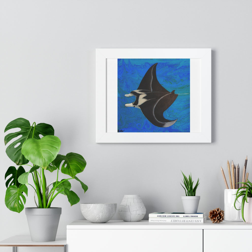 Framed artwork of a manta ray on a wall above a white cabinet with decorative items.