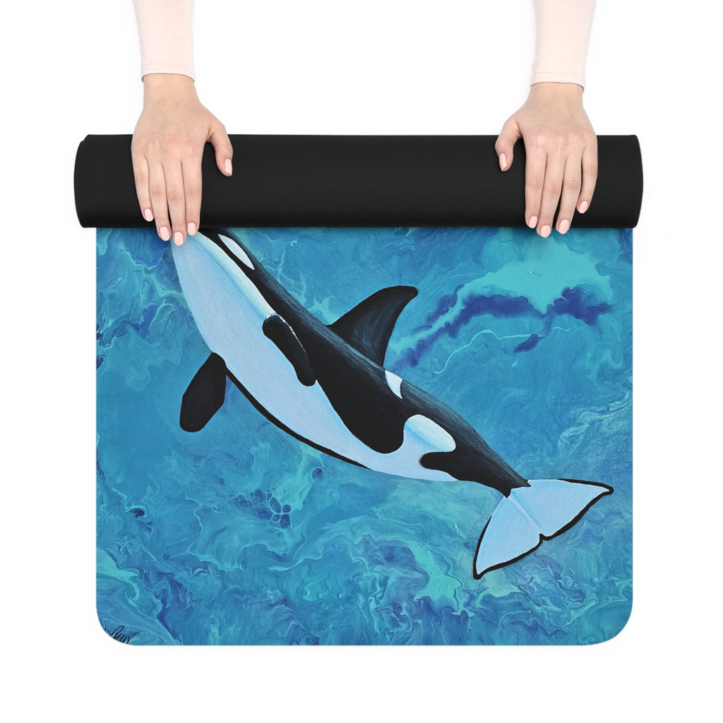 Yoga mat with an orca whale design held by a person