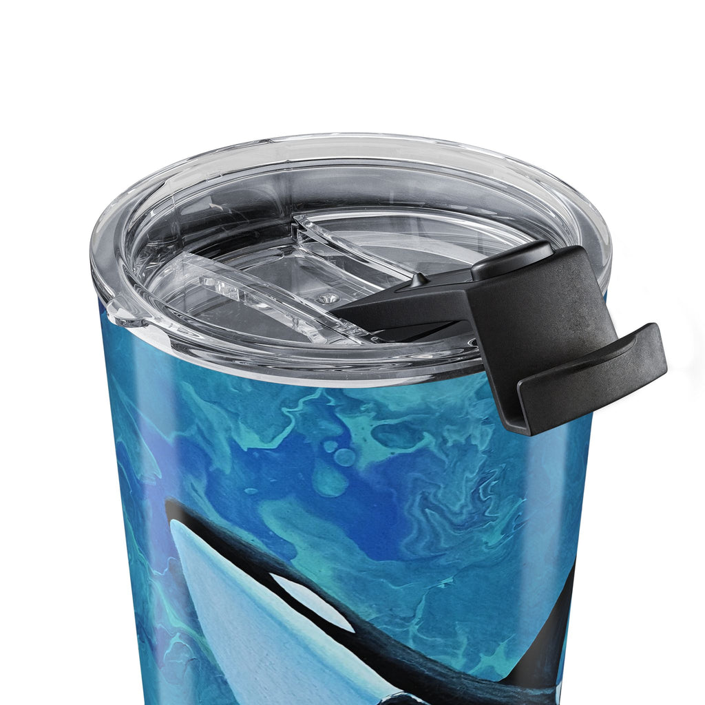 Blue marbled tumbler with a clear lid and black grip on a white background