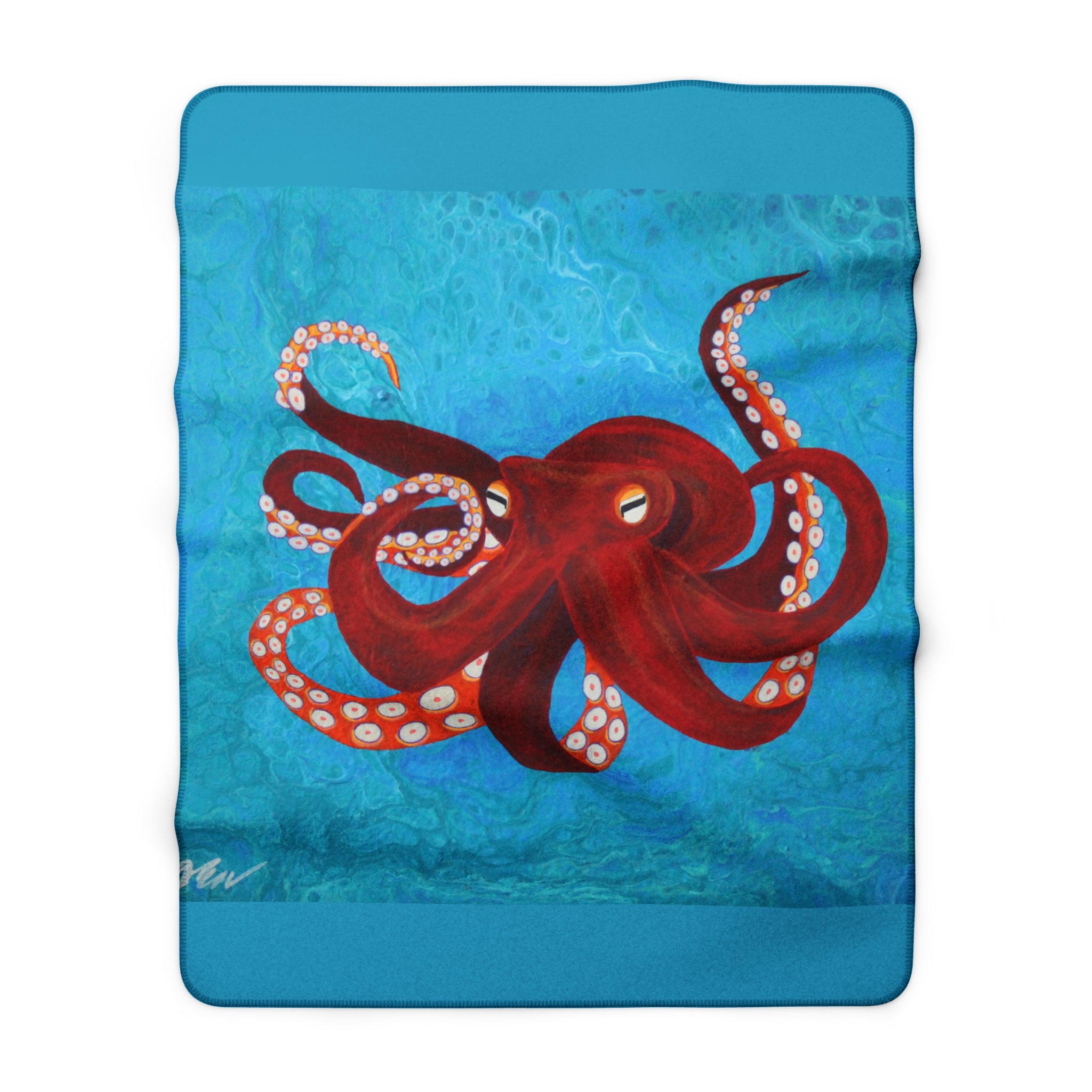 Blanket with red octopus design on a blue water background