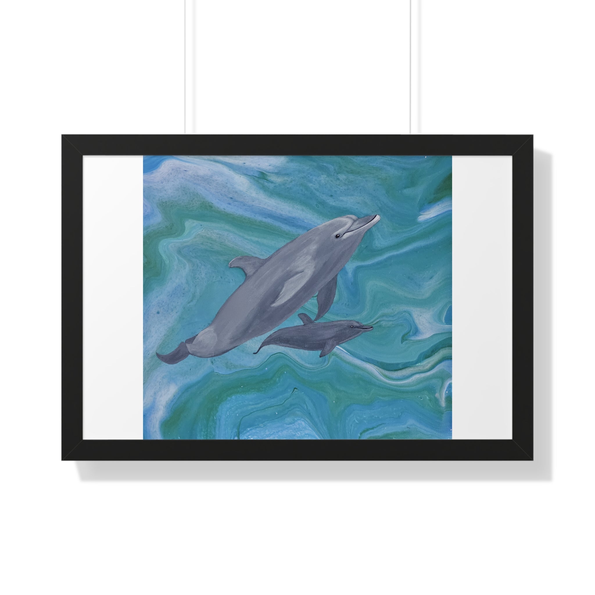 Framed artwork of two dolphins swimming in wavy blue water on a white background