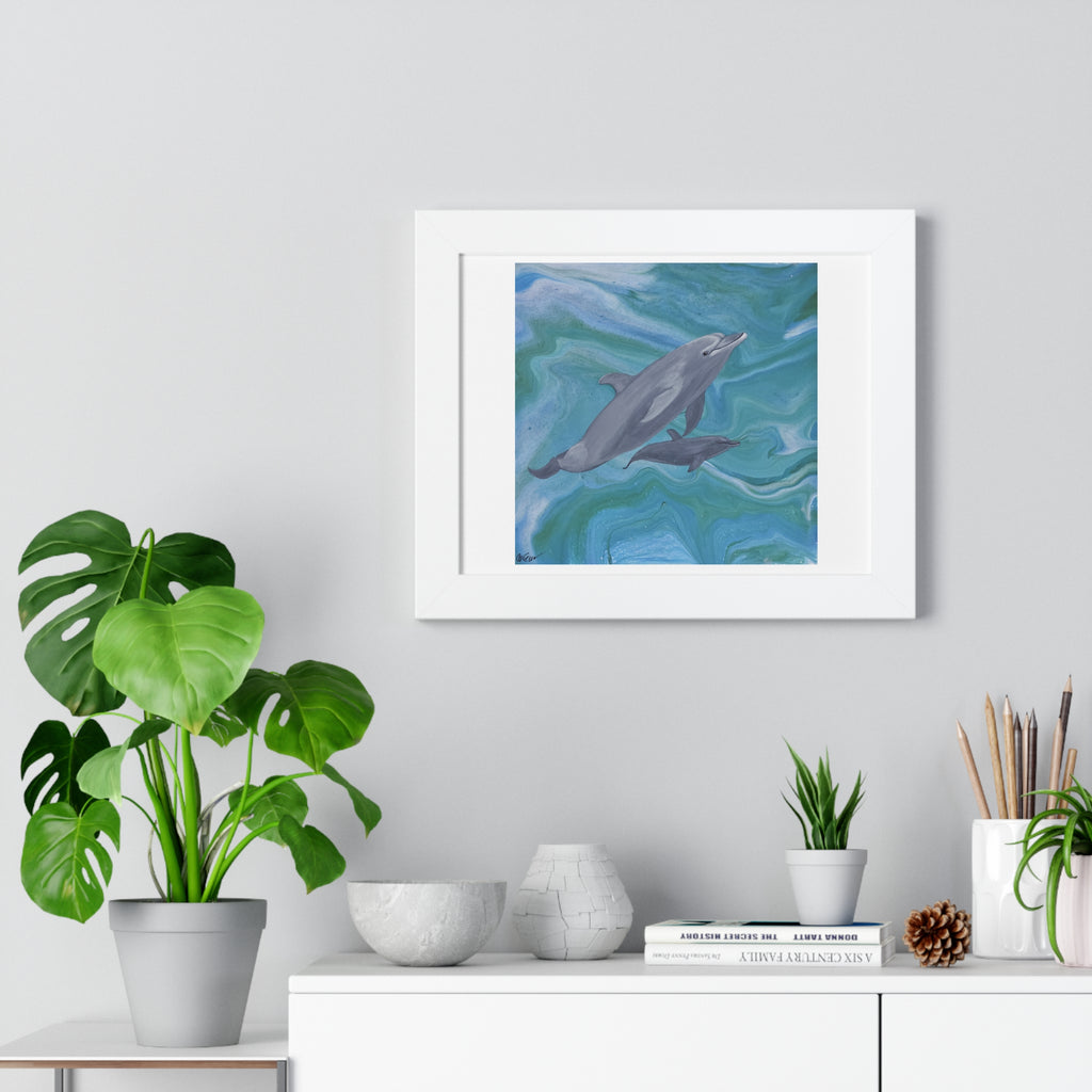 Framed artwork of dolphins on a wall above a white cabinet with decorative items.
