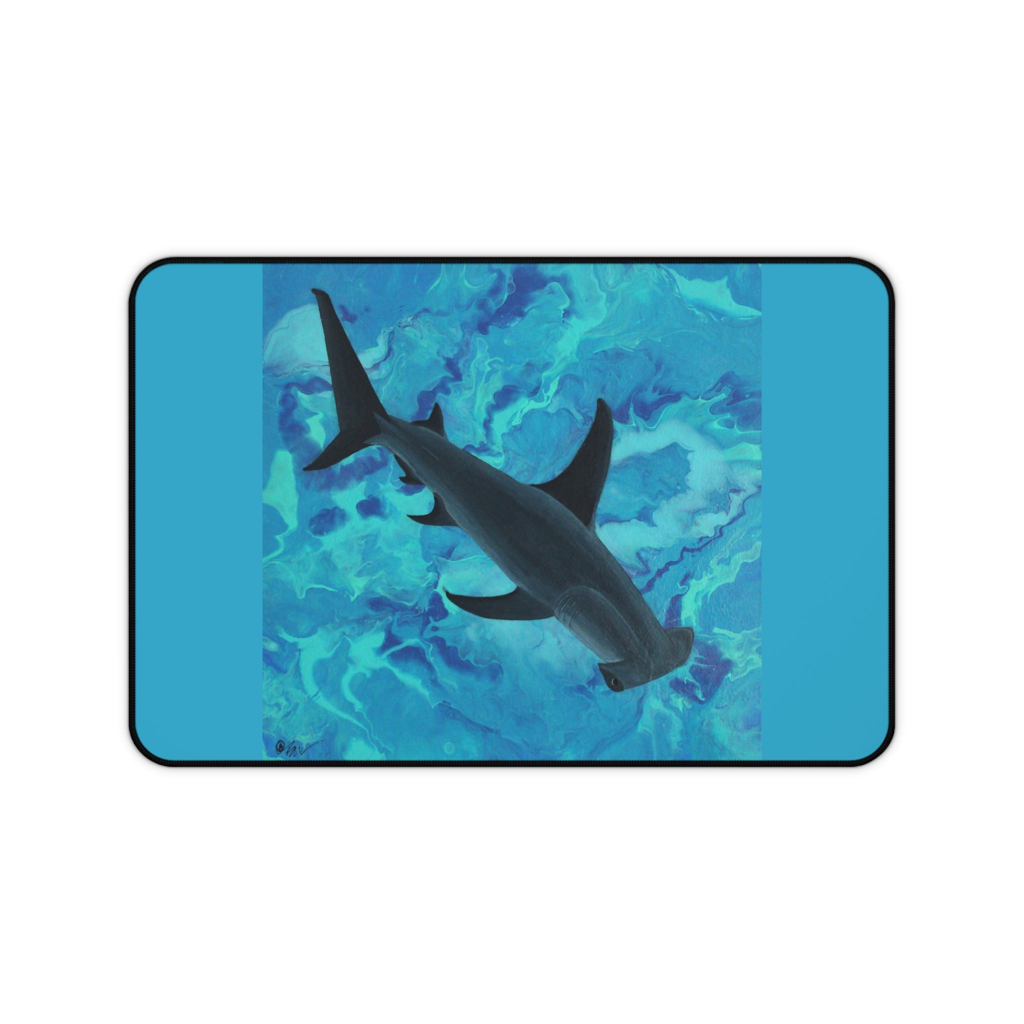 Shark underwater design on a blue and green desk pad