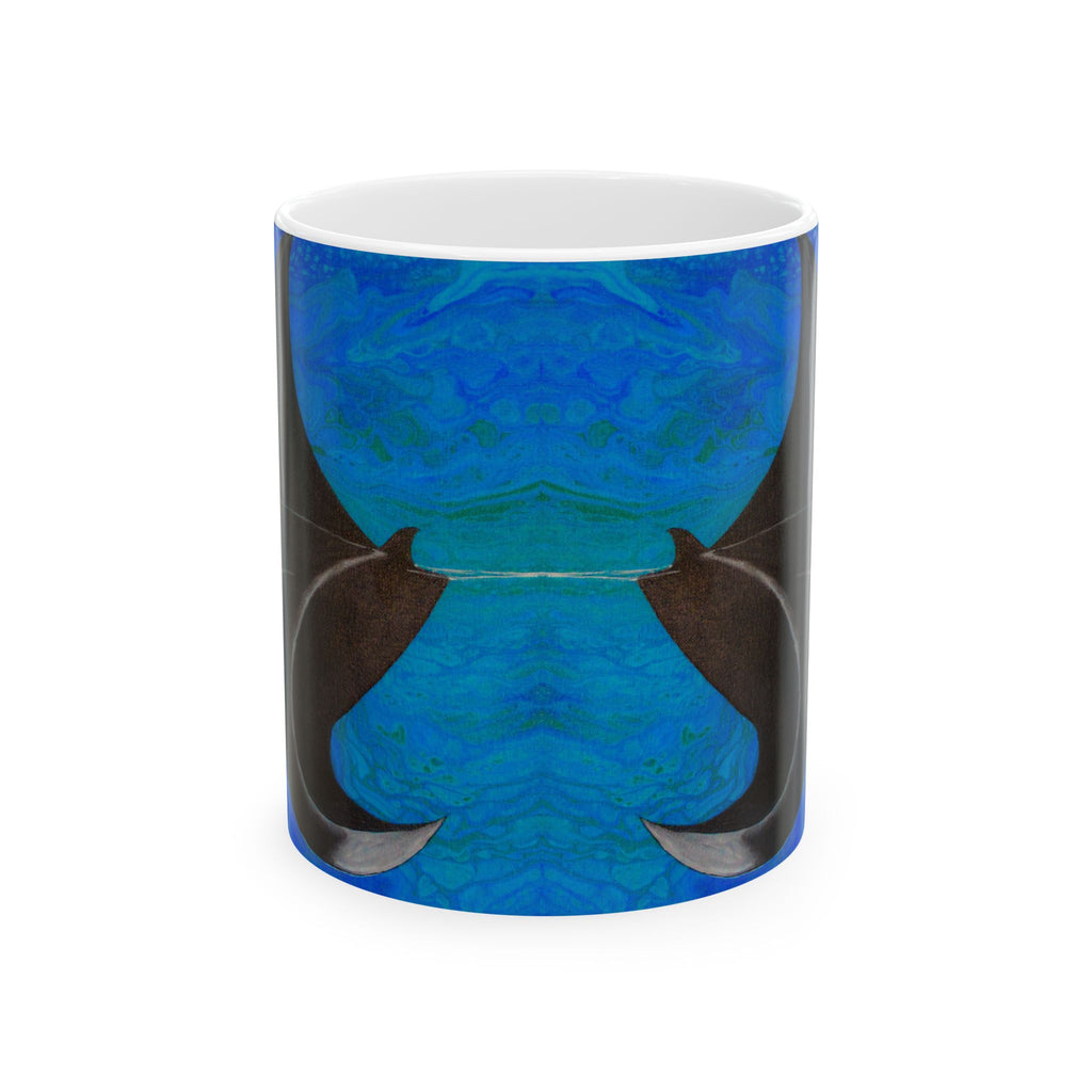 Tumbler with blue and black abstract design on a white background
