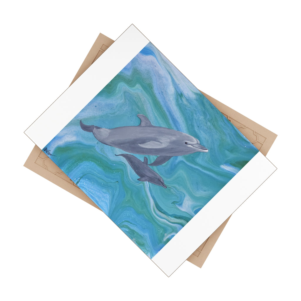 Tile with dolphins on a blue and green abstract background and beige backing