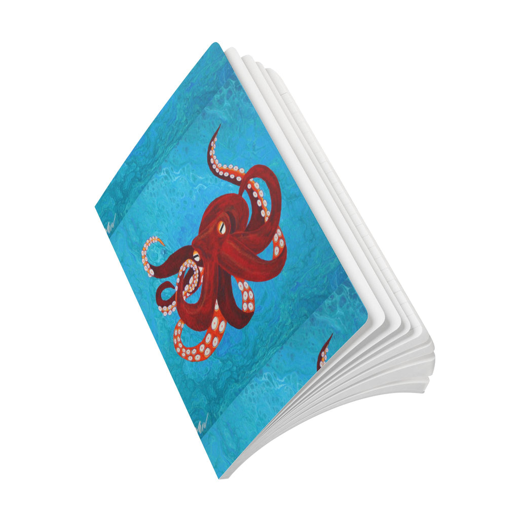 Open Notebook with a red octopus design on a blue background