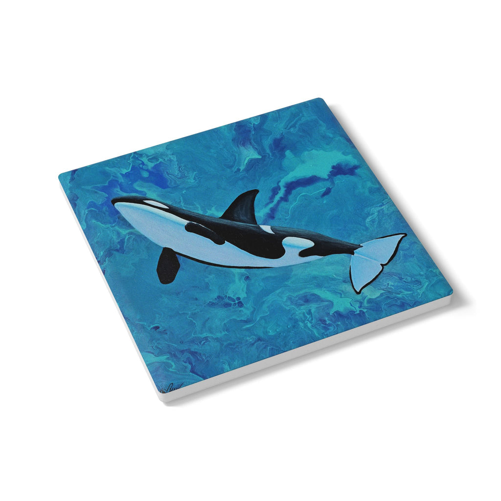 Coaster with an orca whale design on a blue watercolor background
