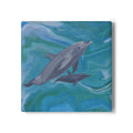Coaster with two dolphins swimming on a blue and green abstract background