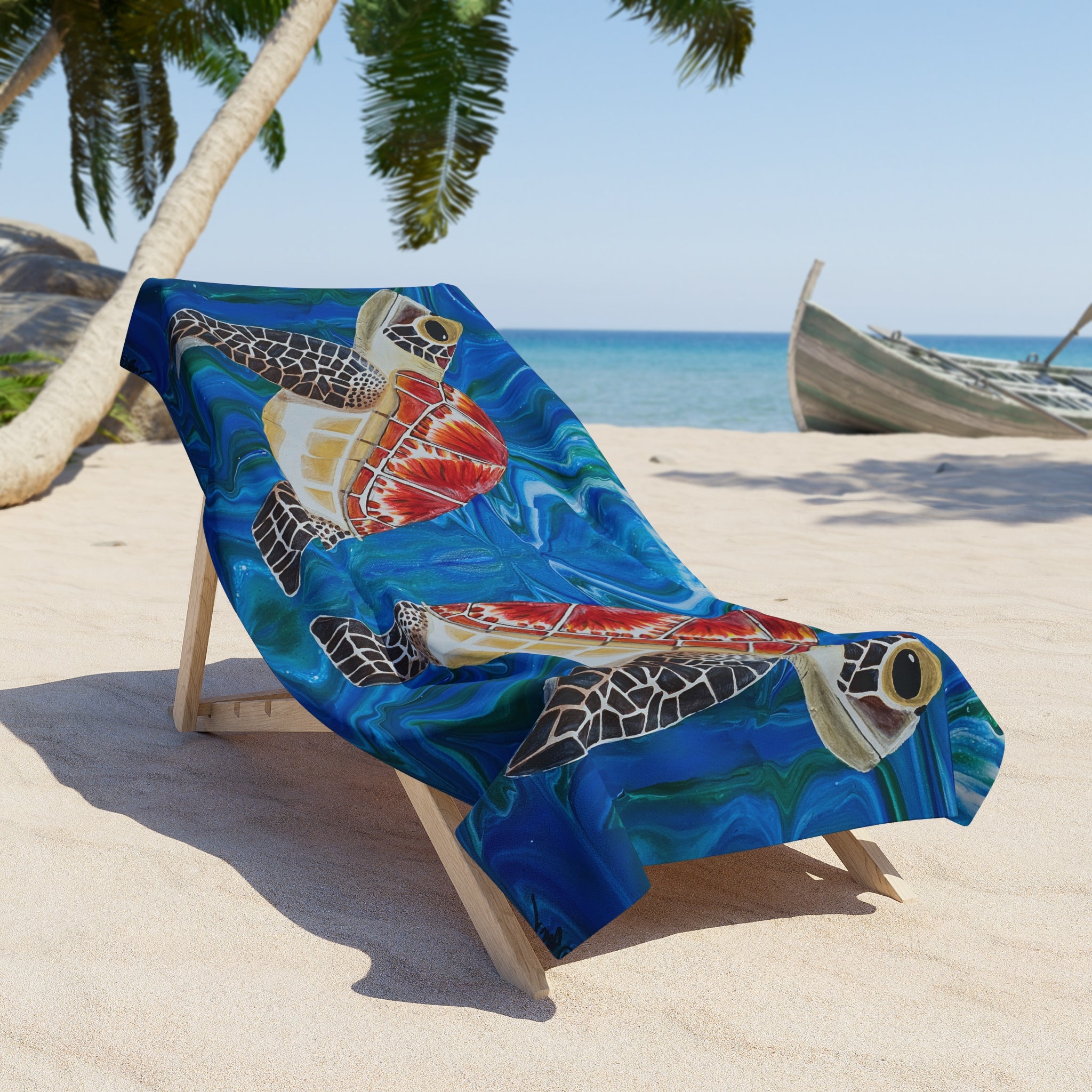 Beach chair with a turtle-themed towel/blanket draped over it on a sandy beach with palm trees and a boat in the background.