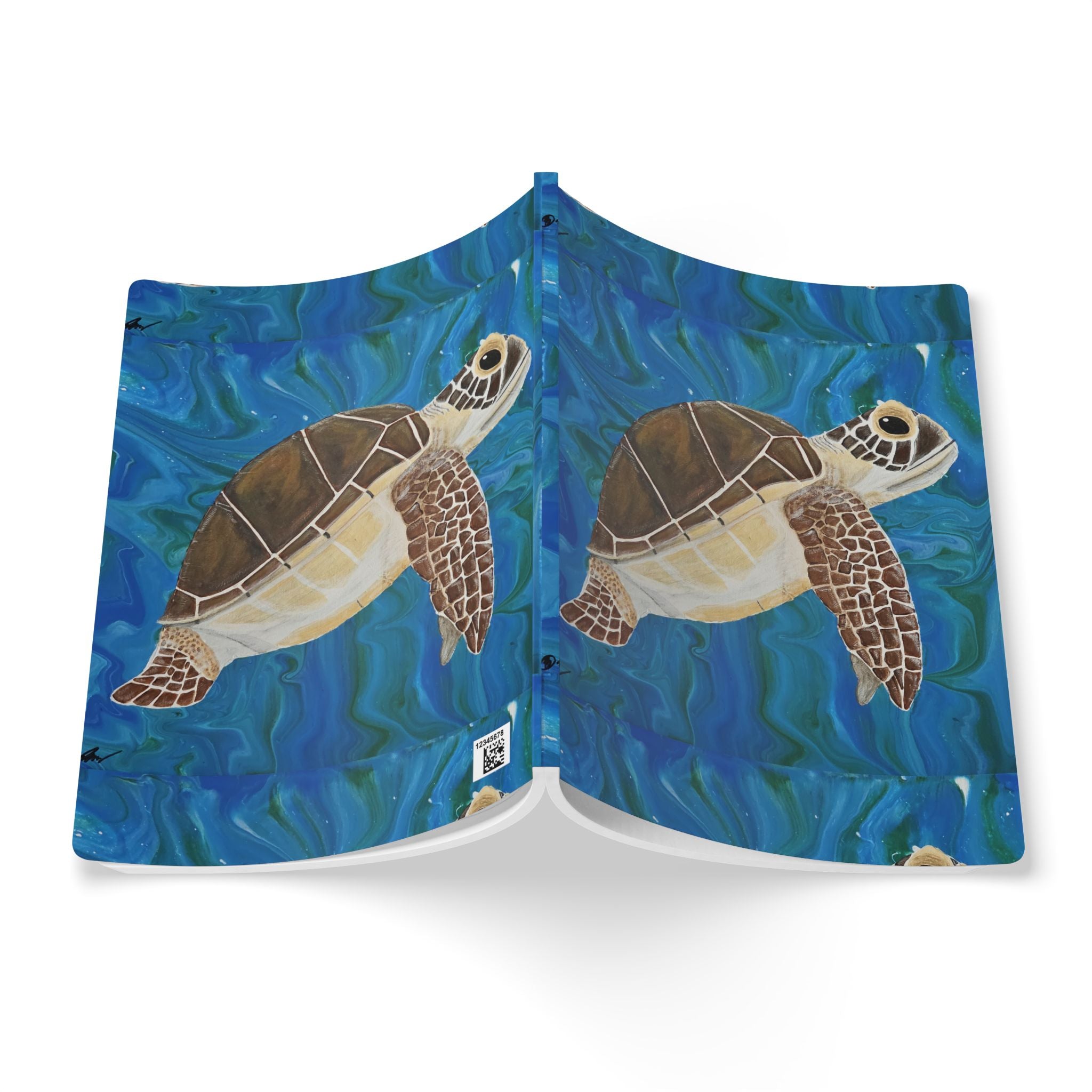 Open notebook with turtle design on a blue ocean background