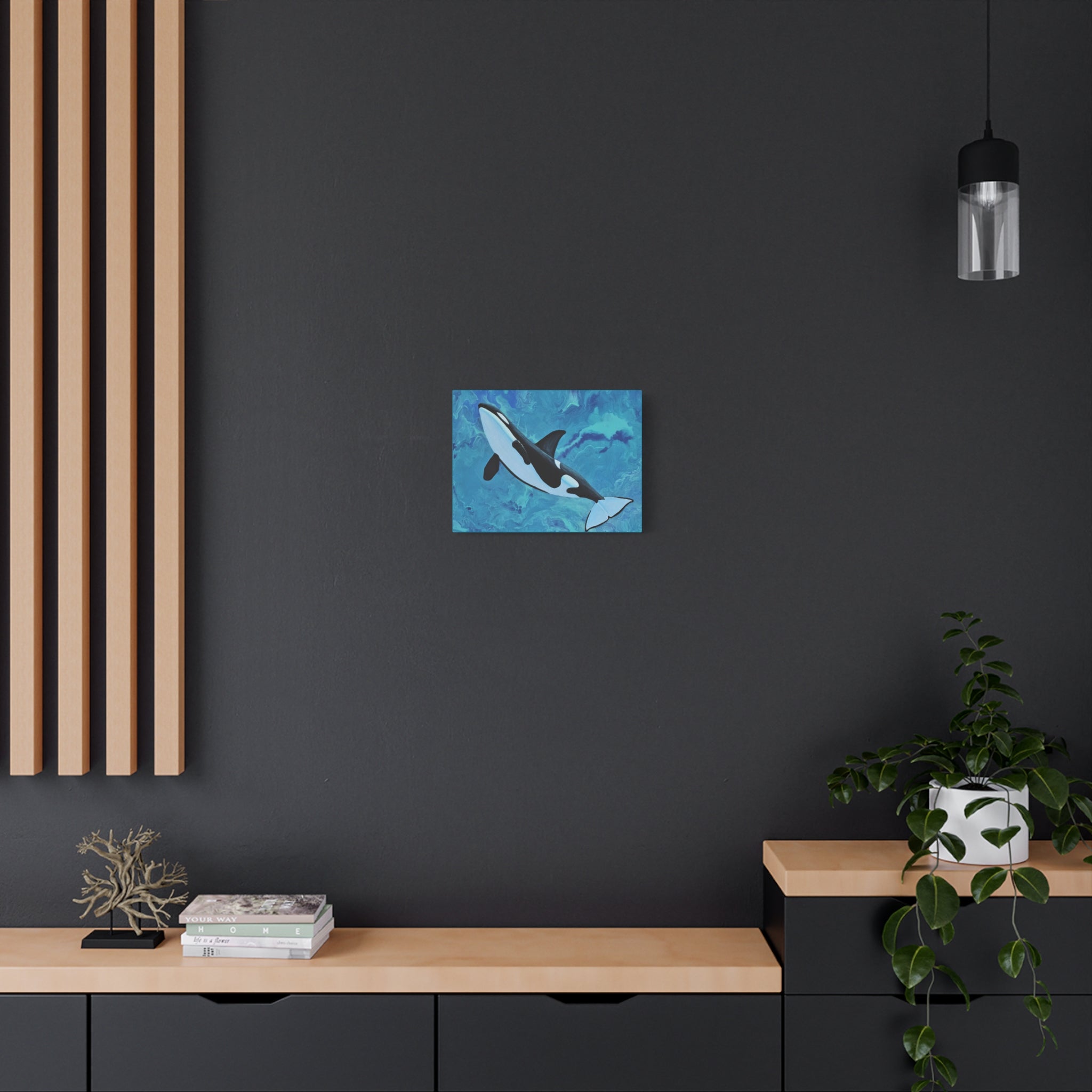 Modern interior with a dark wall, wooden shelf, and decorative items.