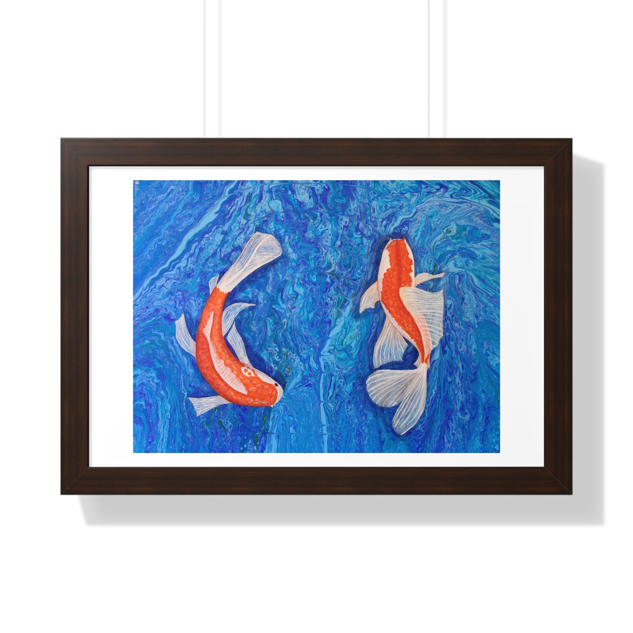 Framed artwork of two koi fish on a blue background