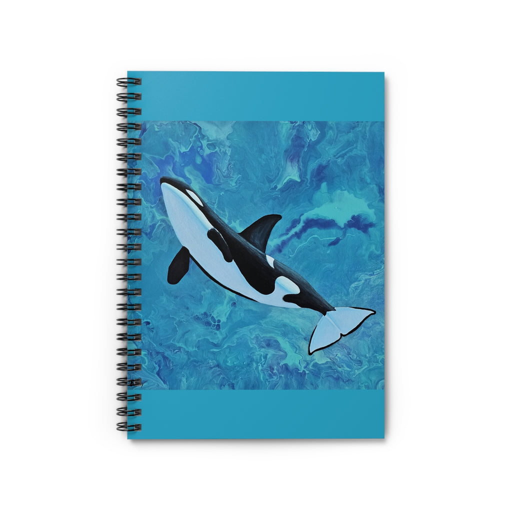 Notebook with an orca whale design on a blue watercolor background