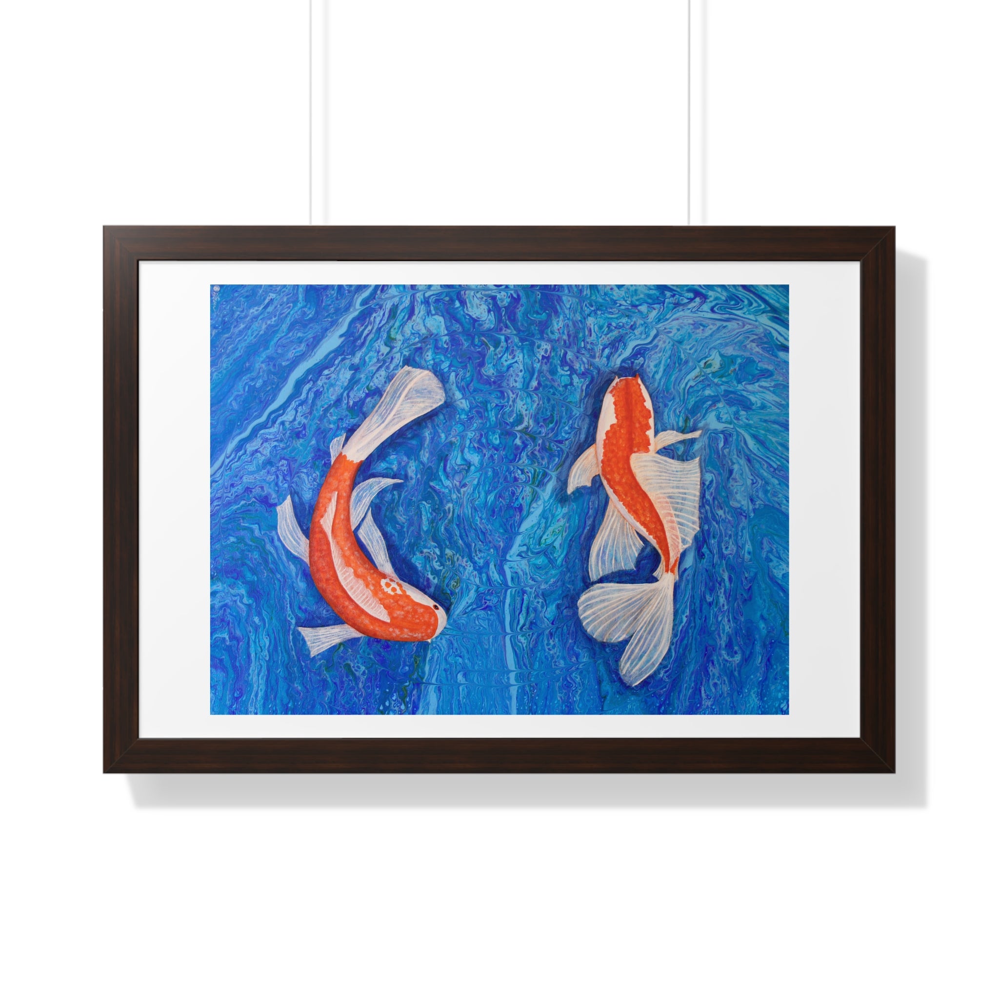 Framed artwork of two koi fish on a blue background