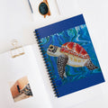 Notebook with a turtle illustration on a white surface