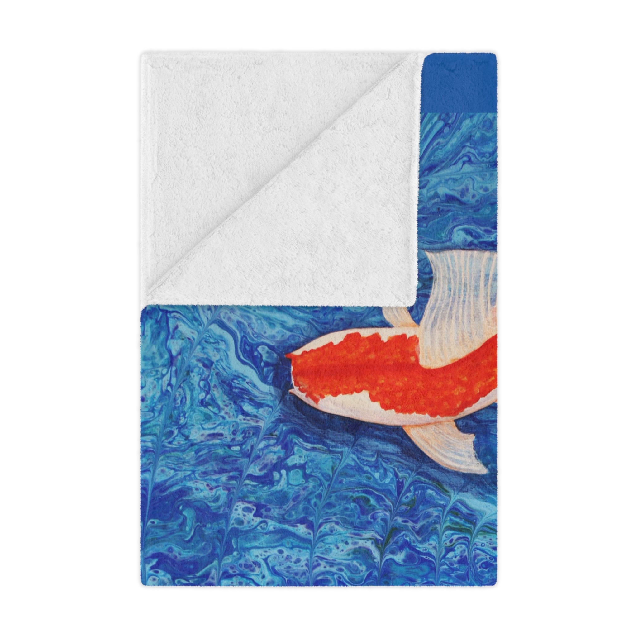 Blanket with a koi fish design on a blue and white background