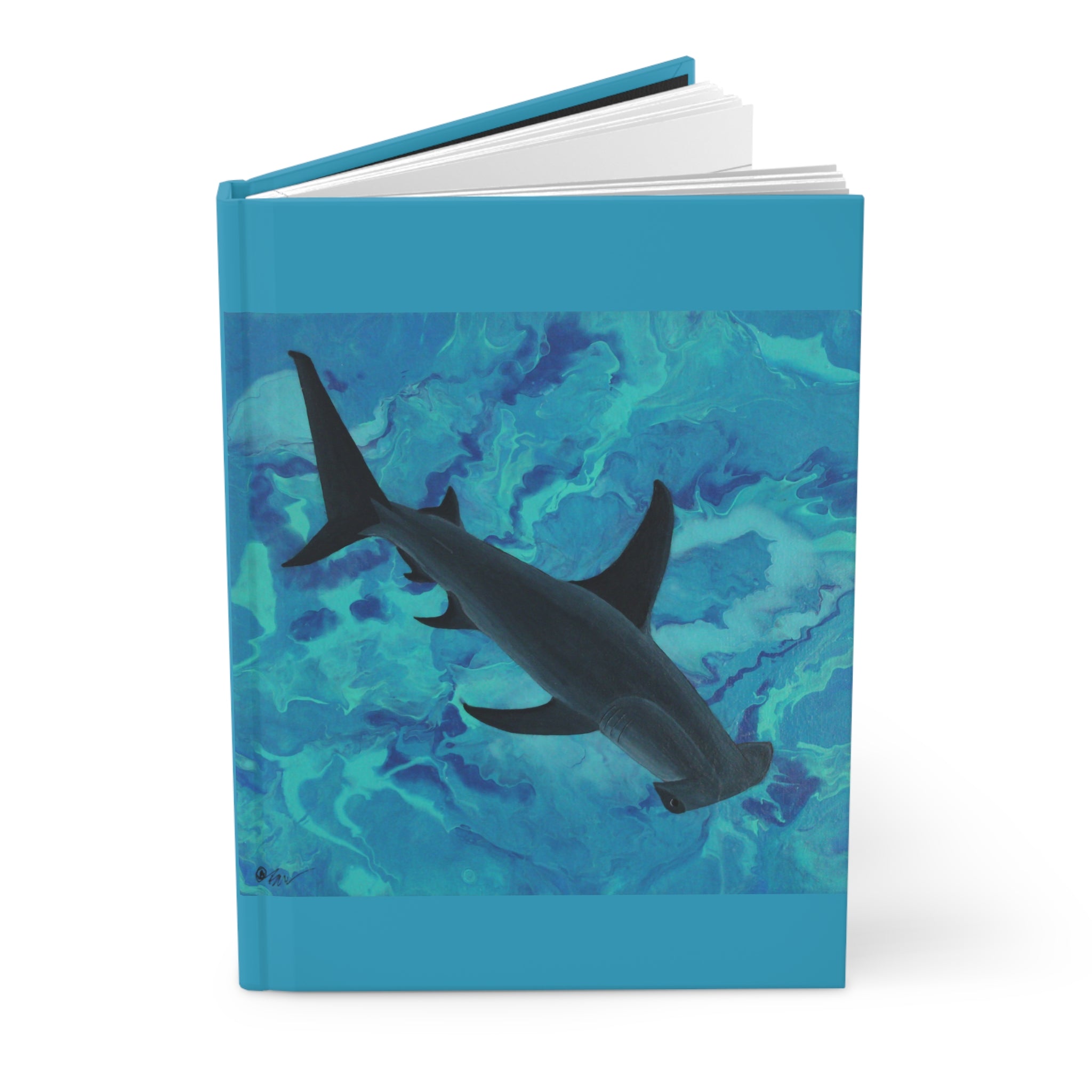 Notebook with a shark design on a blue watercolor background