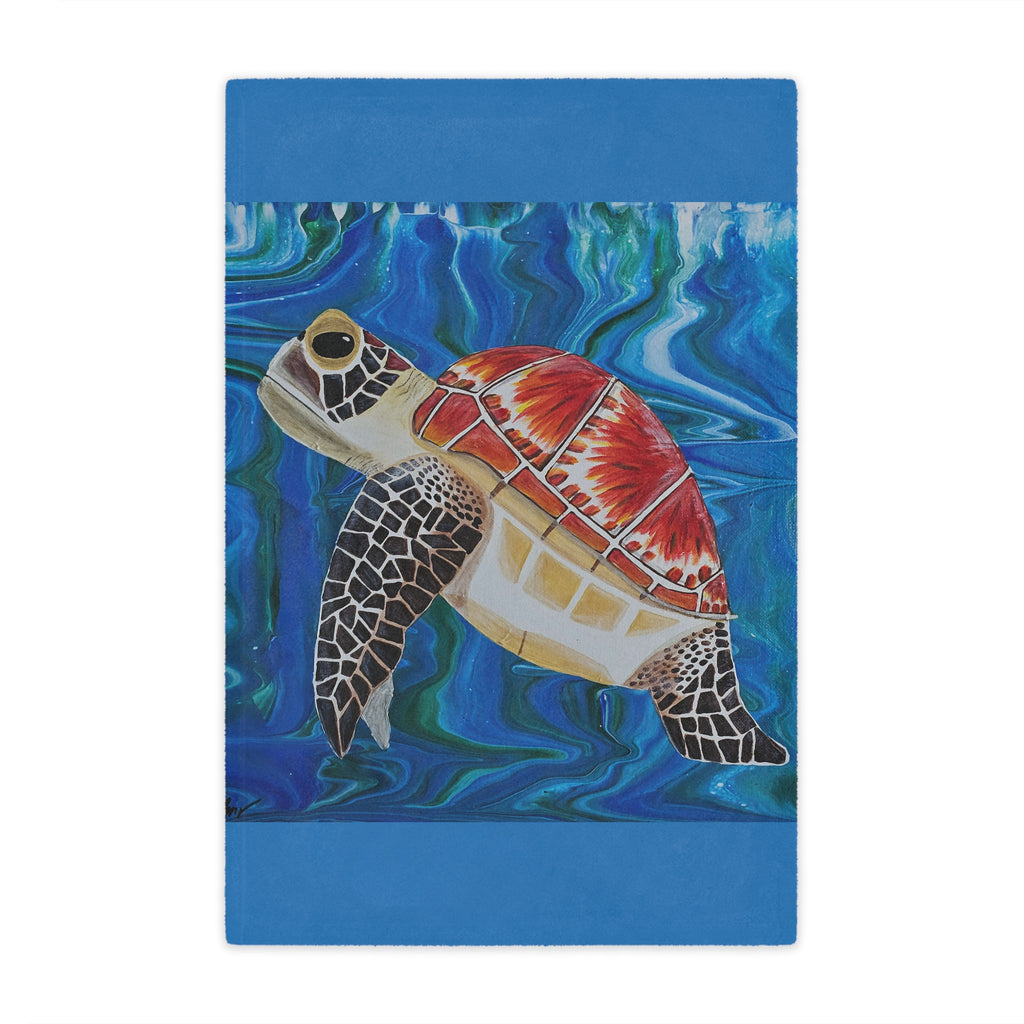 Blanket with a colorful turtle design on a blue background