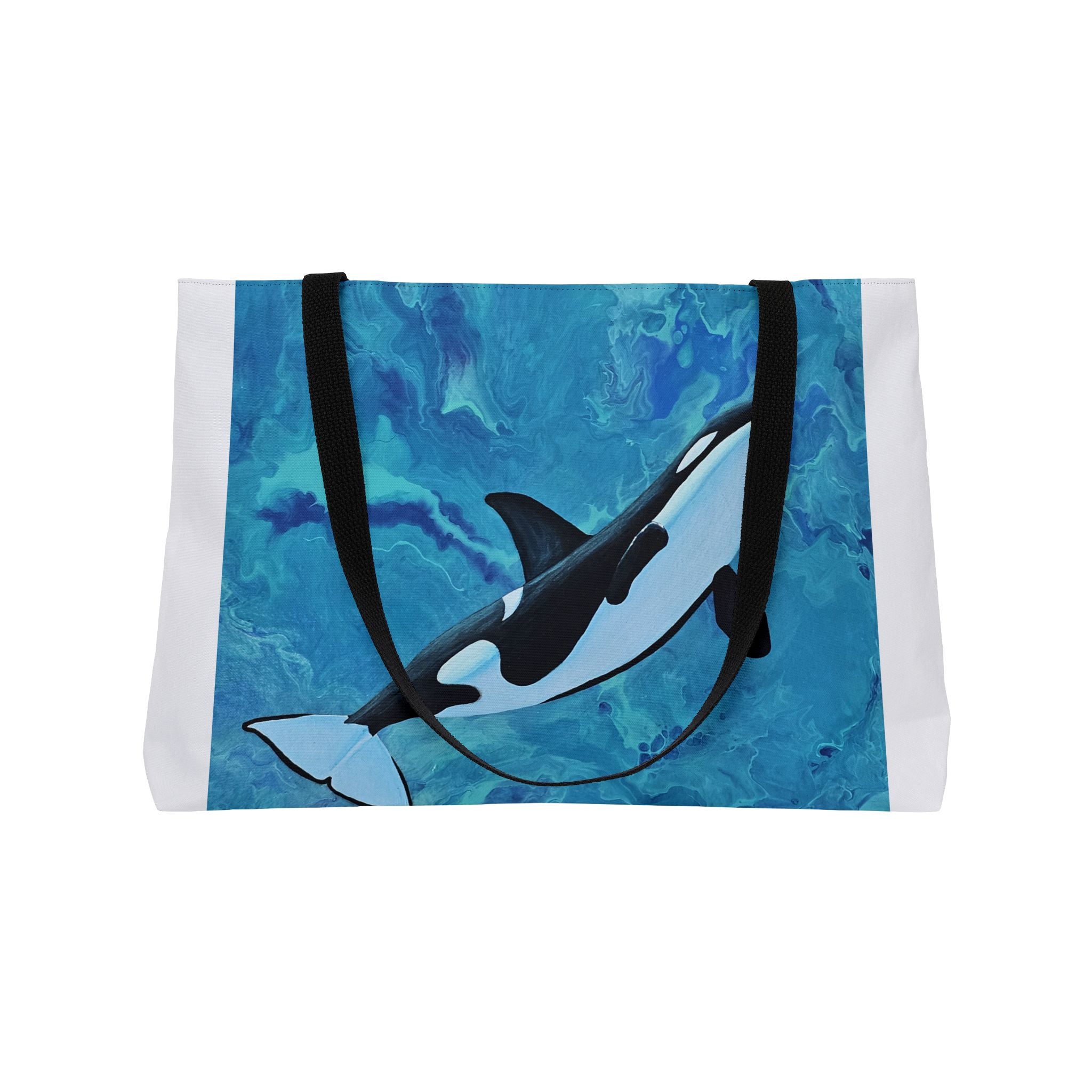 Tote bag with an orca whale design on a blue watercolor background