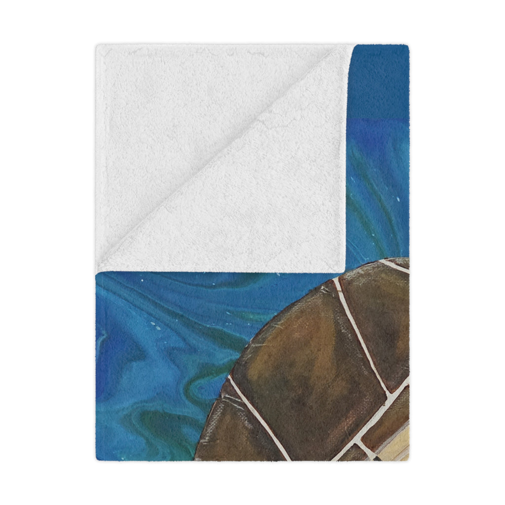 Folded blanket with blue and brown pattern on a white background