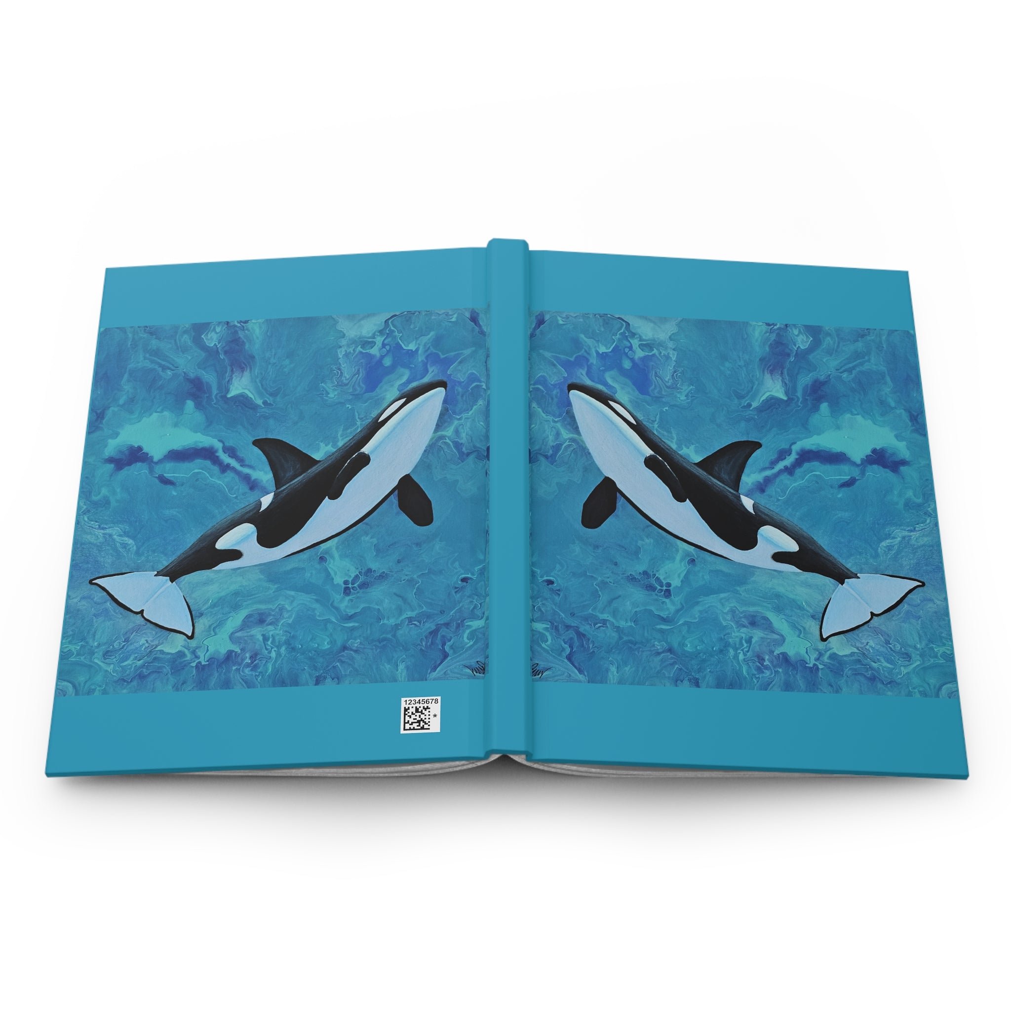 Open book with illustrations of orcas on a blue watercolor background