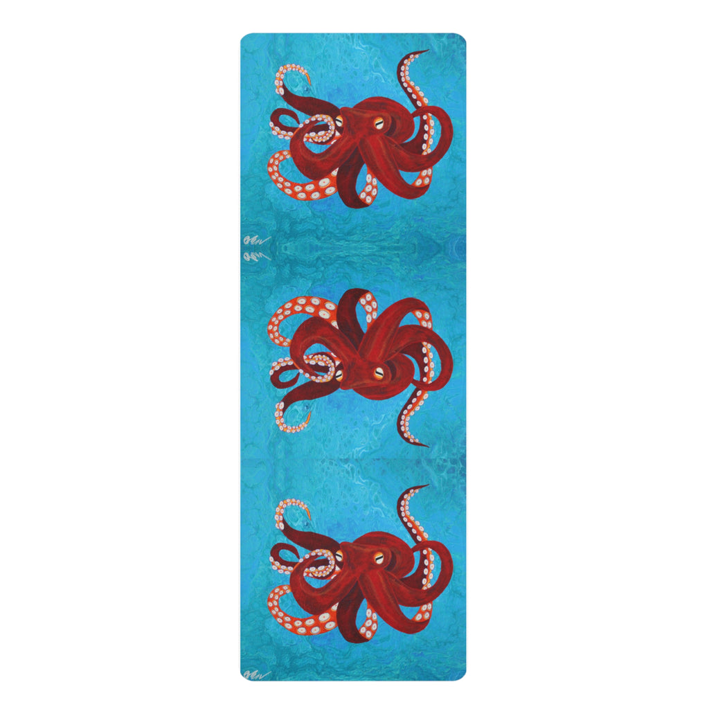 Yoga mat with red octopus design on a blue background