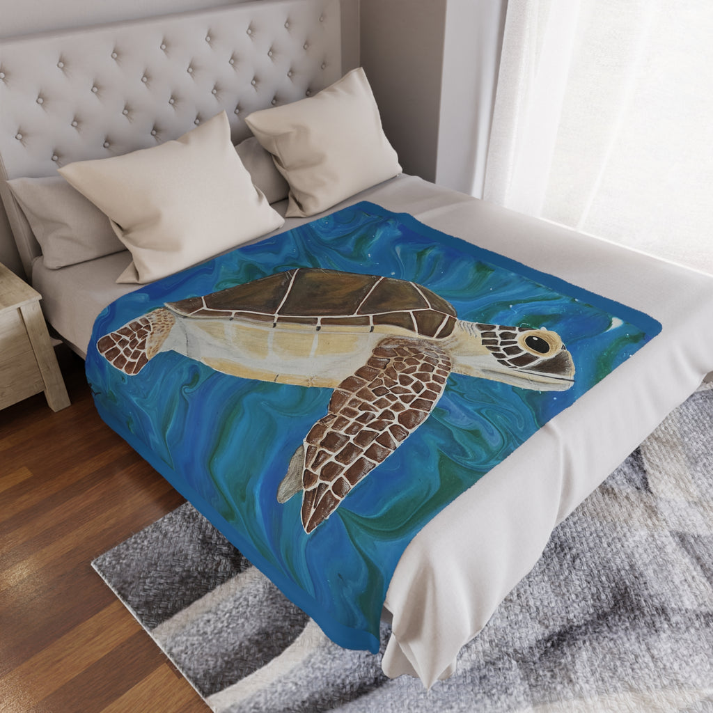 Bed with a turtle-themed blanket draped over it in a bedroom setting.