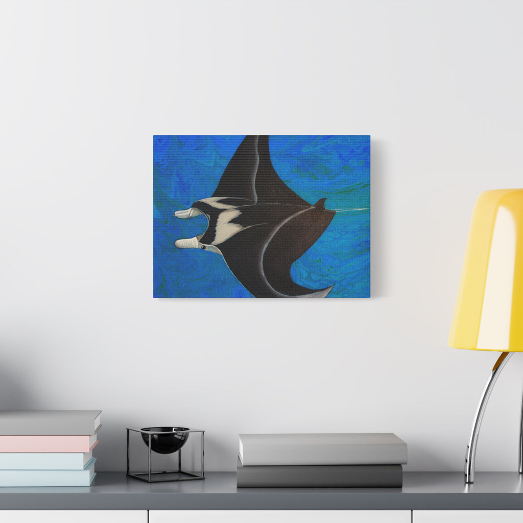 Abstract painting of a manta ray on a blue background, displayed on a wall above a desk.