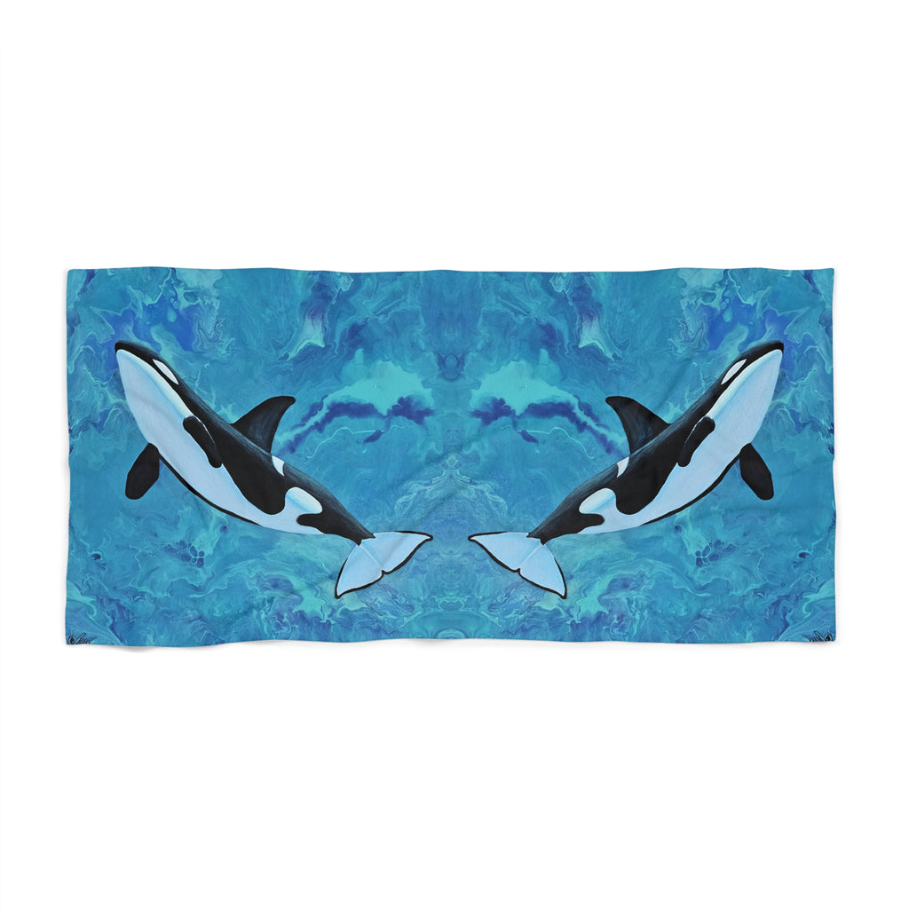 Towel/blanket with orca whale design on a blue patterned background