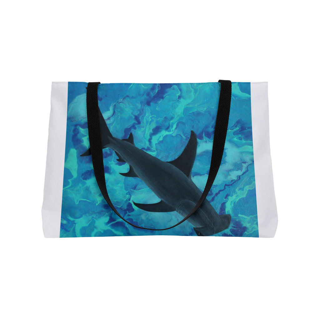 Tote bag with shark design on a blue and green watercolor background
