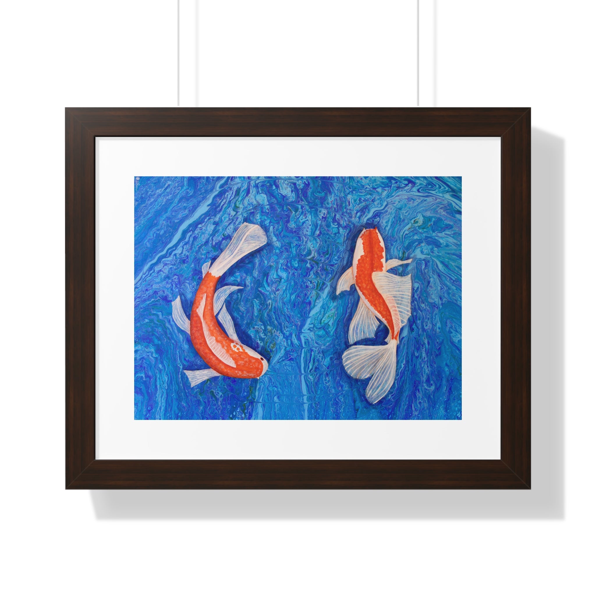 Framed artwork of two koi fish on a blue background
