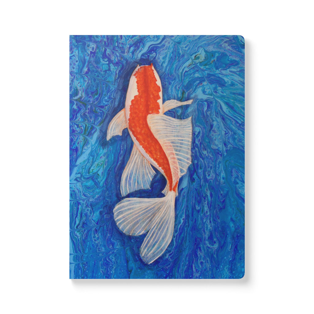 Notebook with a goldfish illustration on a blue marbled background