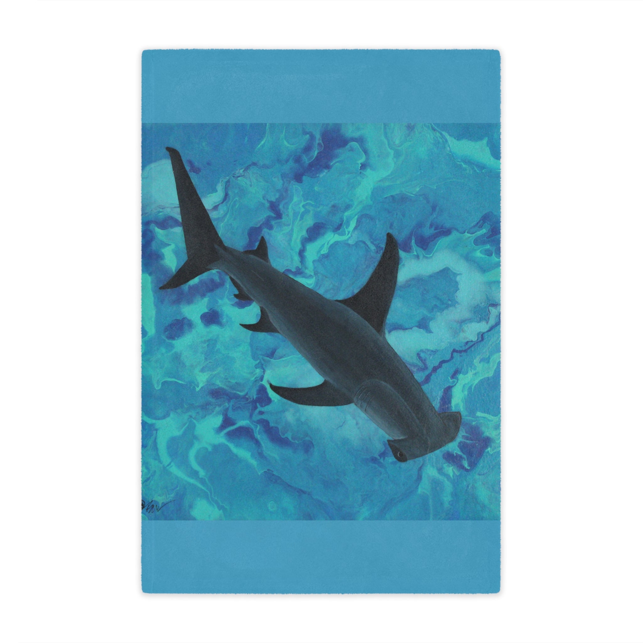 Blue blanket with a shark design on a white background