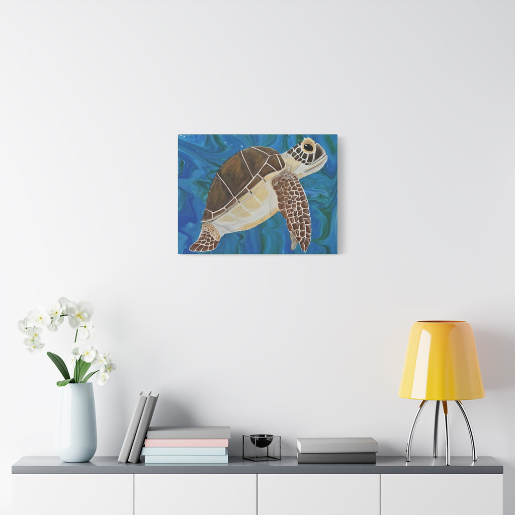 Canvas print of a turtle on a wall above a shelf with decor items.