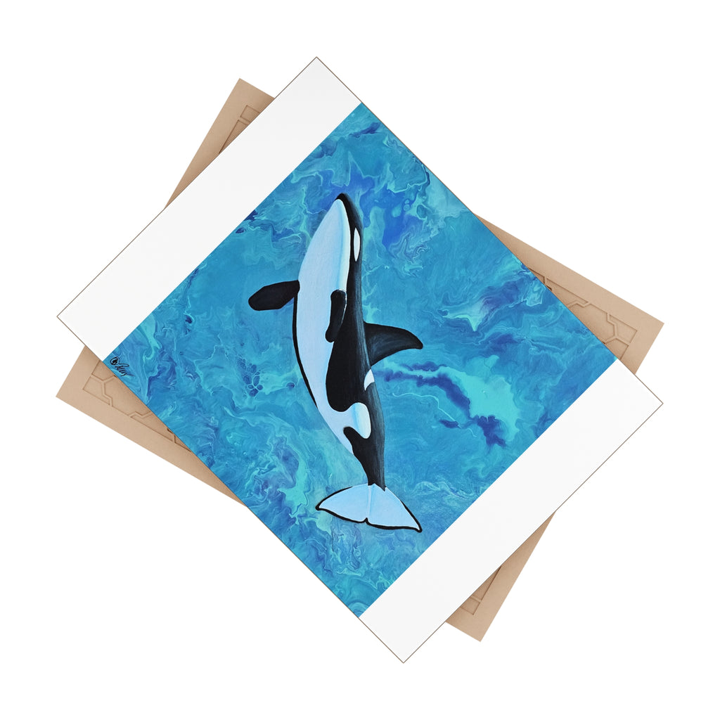 Card with an orca whale design on a blue watercolor background tile