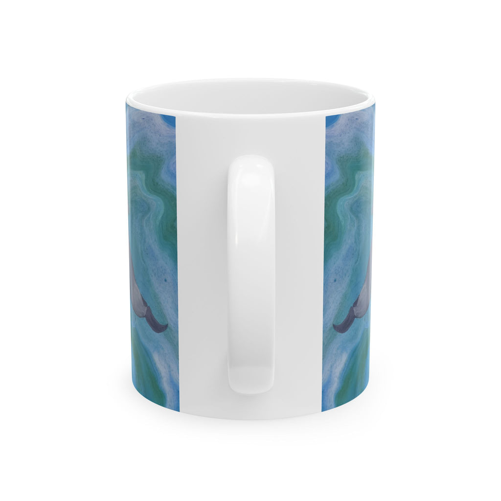 White mug with blue and green marbled design on a white background