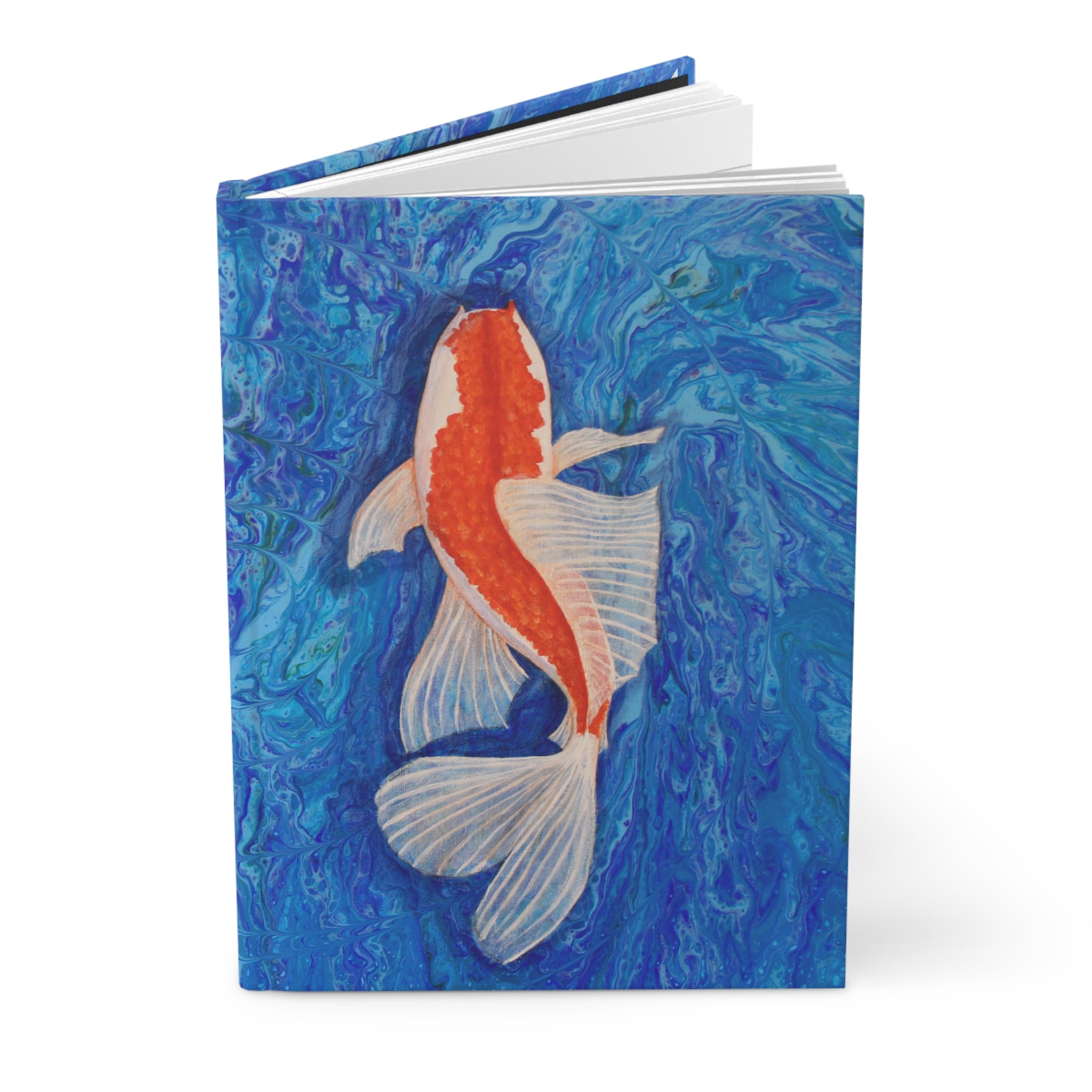 Notebook with a koi fish design on a blue abstract background