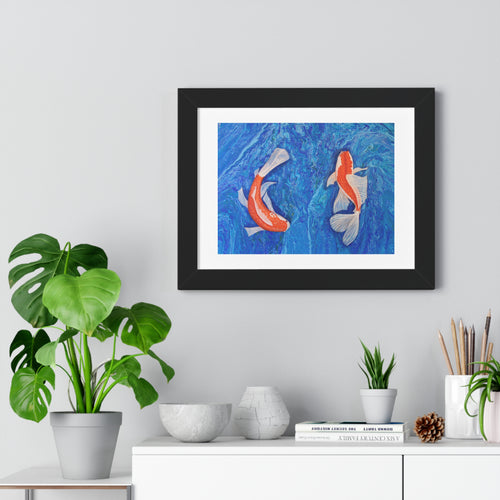 Framed artwork of two koi fish on a blue background, displayed in a room with plants and decor.